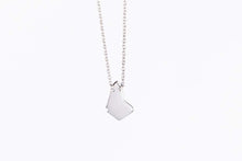 Load image into Gallery viewer, Geo bim necklace in silver displayed on white background, close up
